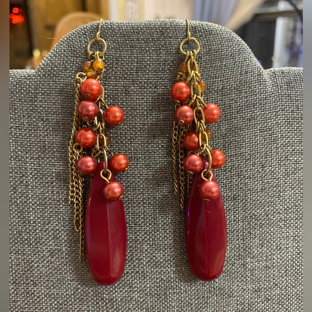 Red dangle pierced earrings.  Red pearl beads/chain fringe.  Approx 4” long.